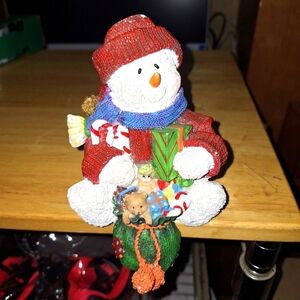 A Badcock Snowman stocking holder. 3"x4" base and 4.5" tall. Pre-loved